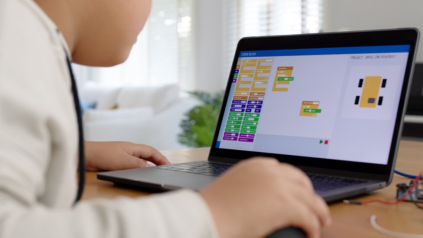 Student programming with Scratch coding language during a remote STEM lesson